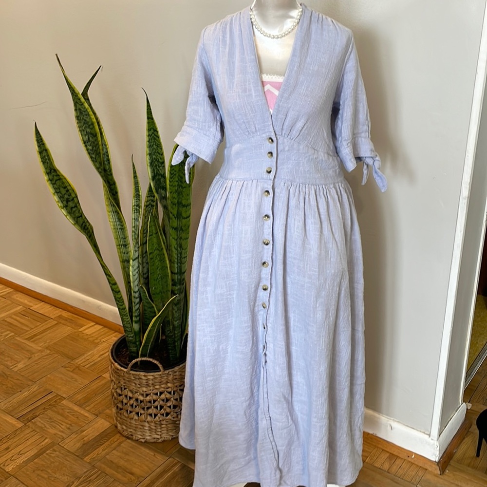 Free People Size Medium light blue button down midi dress deep V neck